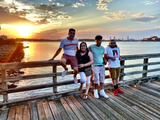The Filho family together in East Bridgewater Massachusetts sharing a family moment connected to construction, home life, and family business.